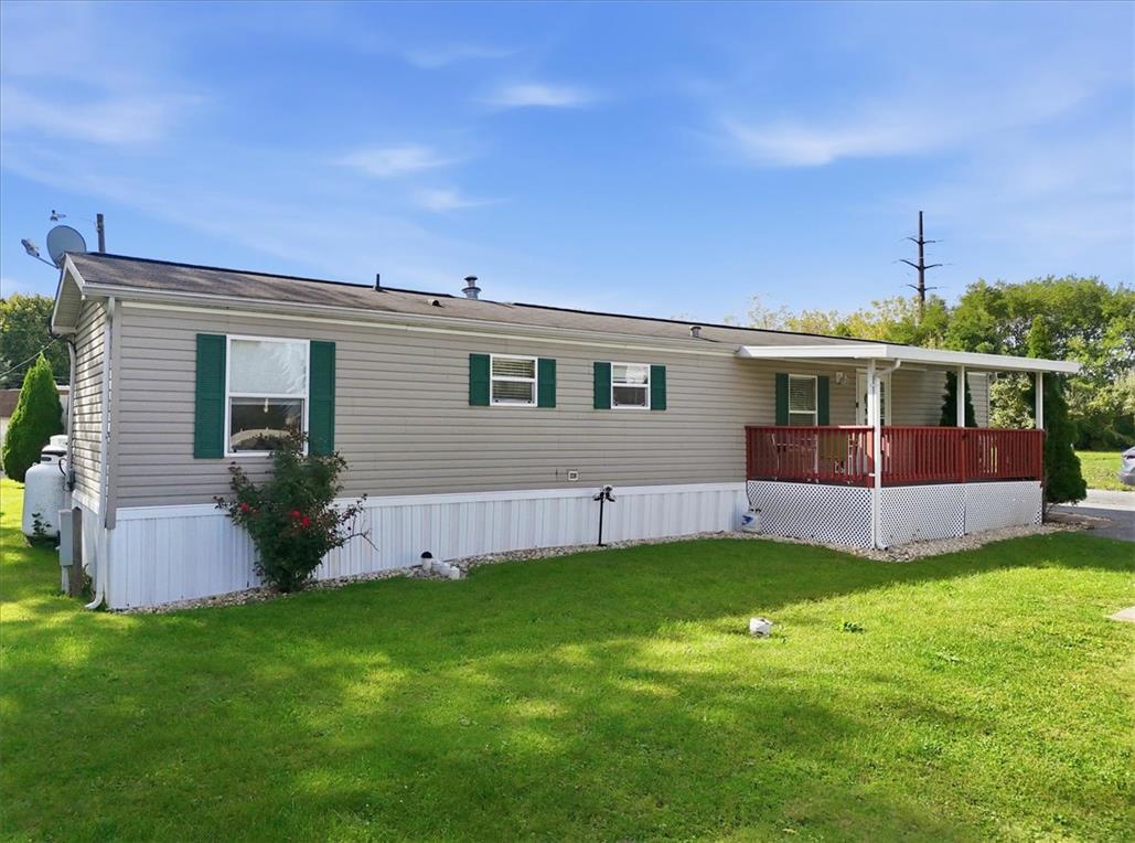 6129 Memorial Road Allentown, PA 18104 - Photo 37 of 46 Horizontal siding and shutters frame the exterior of this single-level home set on a grassy lawn.