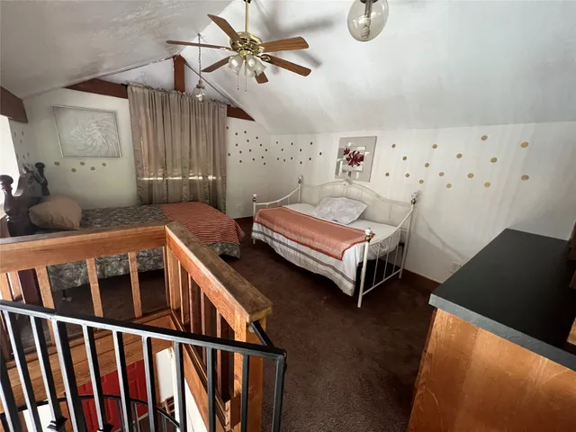 a bedroom with furniture and a window