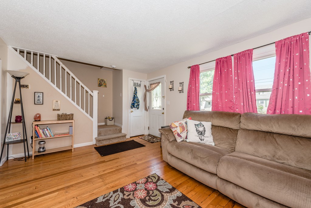 202 Rosewell Street Springfield, MA 01109 - Photo 14 of 25 a living room with furniture and a wooden floor