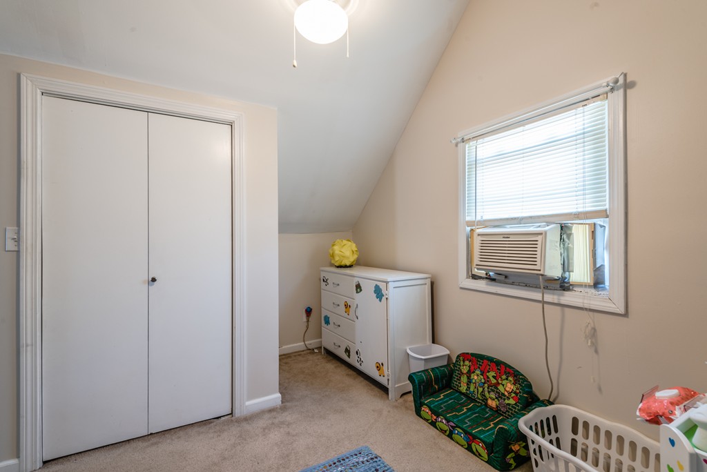 202 Rosewell Street Springfield, MA 01109 - Photo 22 of 25 a bedroom with a bed and a window