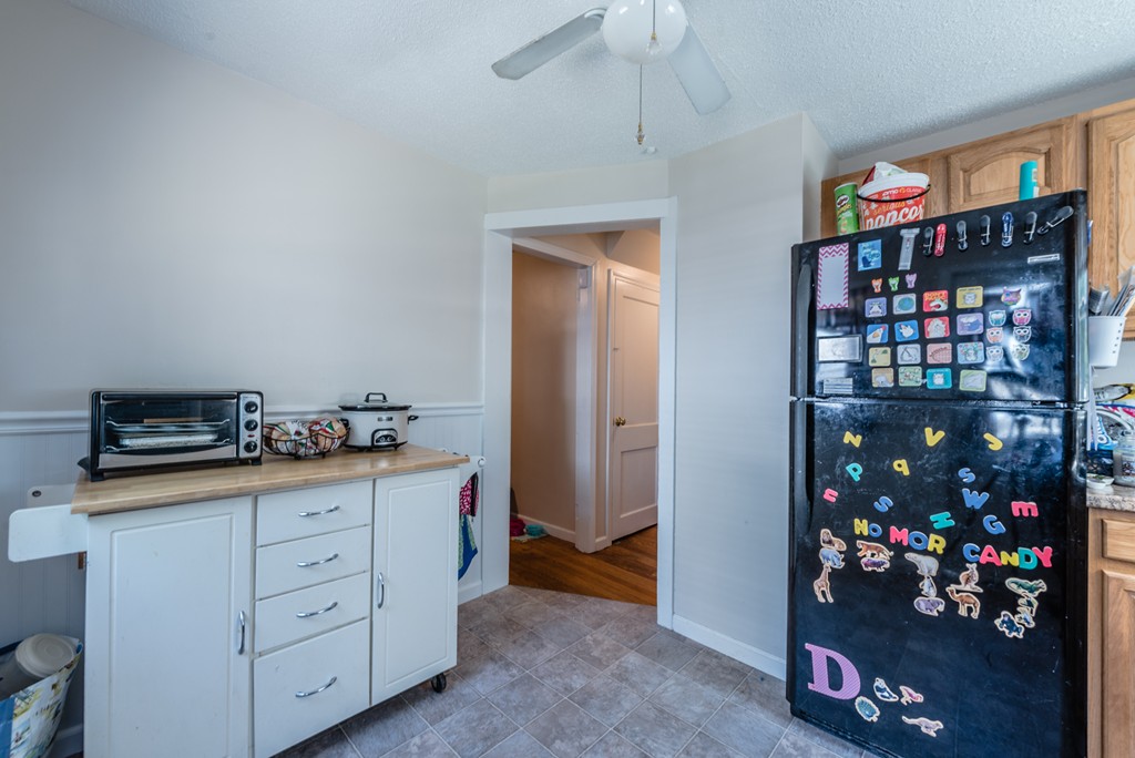 202 Rosewell Street Springfield, MA 01109 - Photo 7 of 25 a kitchen that has a lot of cabinets and wooden floor