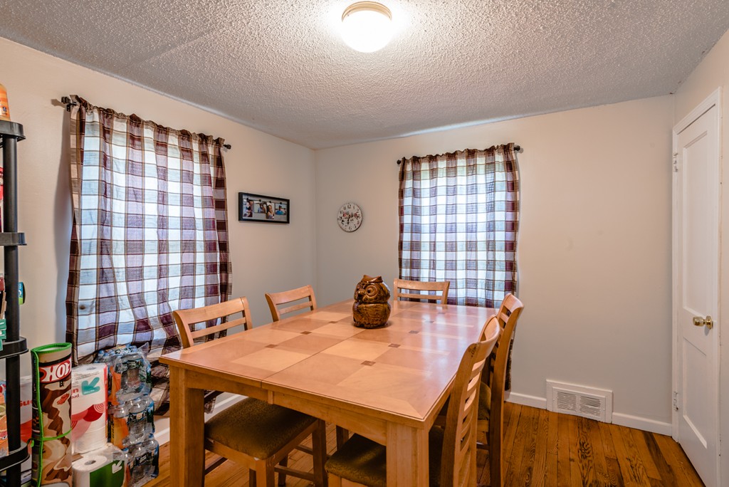 202 Rosewell Street Springfield, MA 01109 - Photo 8 of 25 a view of a dining room with furniture and chandelier