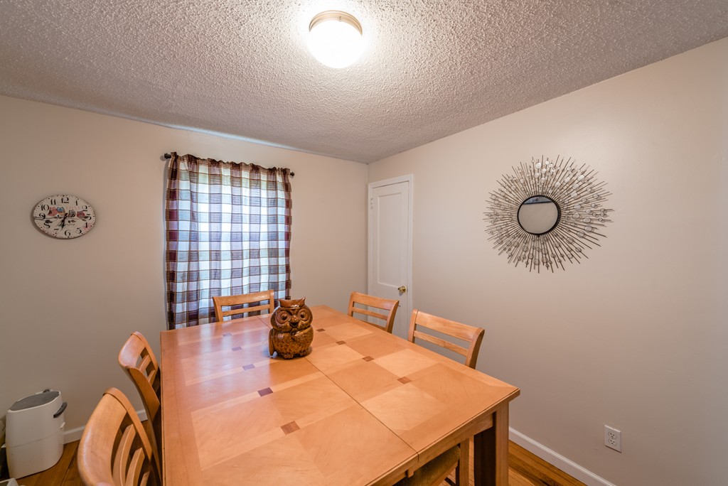 202 Rosewell Street Springfield, MA 01109 - Photo 9 of 25 a view of a dining room with furniture