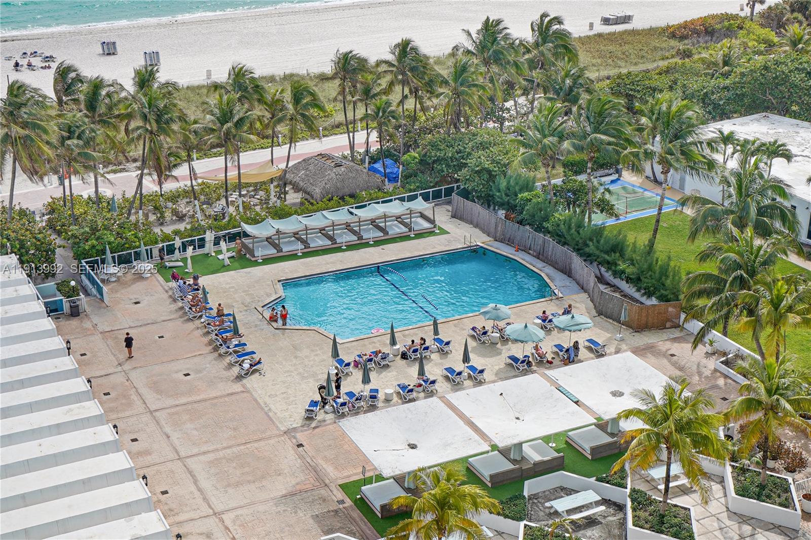 5101 Collins Avenue, Unit 14R Miami Beach, FL 33140 - Photo 9 of 9 an aerial view of a house with a yard basket ball court and outdoor seating