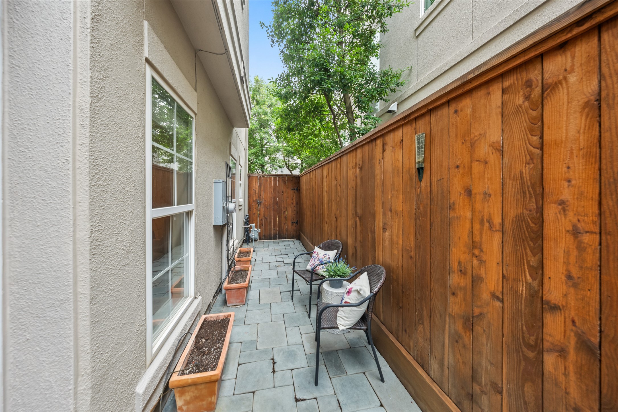 2708 Wroxton Road West University Place, TX 77005 - Photo 19 of 22 Charming, low-maintenance patio with convenient drip lines for effortless gardening.