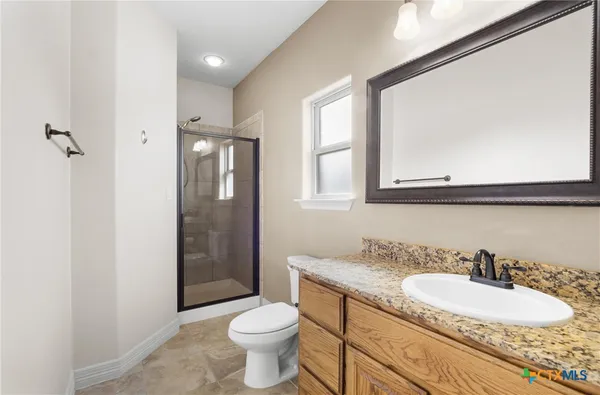 a view of a kitchen with sink and cabinets