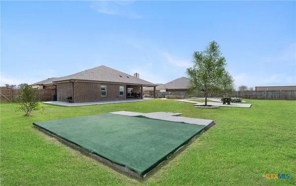 a front view of a house with a yard and porch