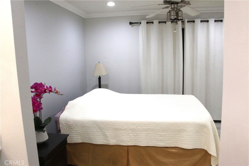 7735 Moordale Circle, Unit 246 Stanton, CA 90680 - Photo 13 of 21 a bedroom with a bed and a table