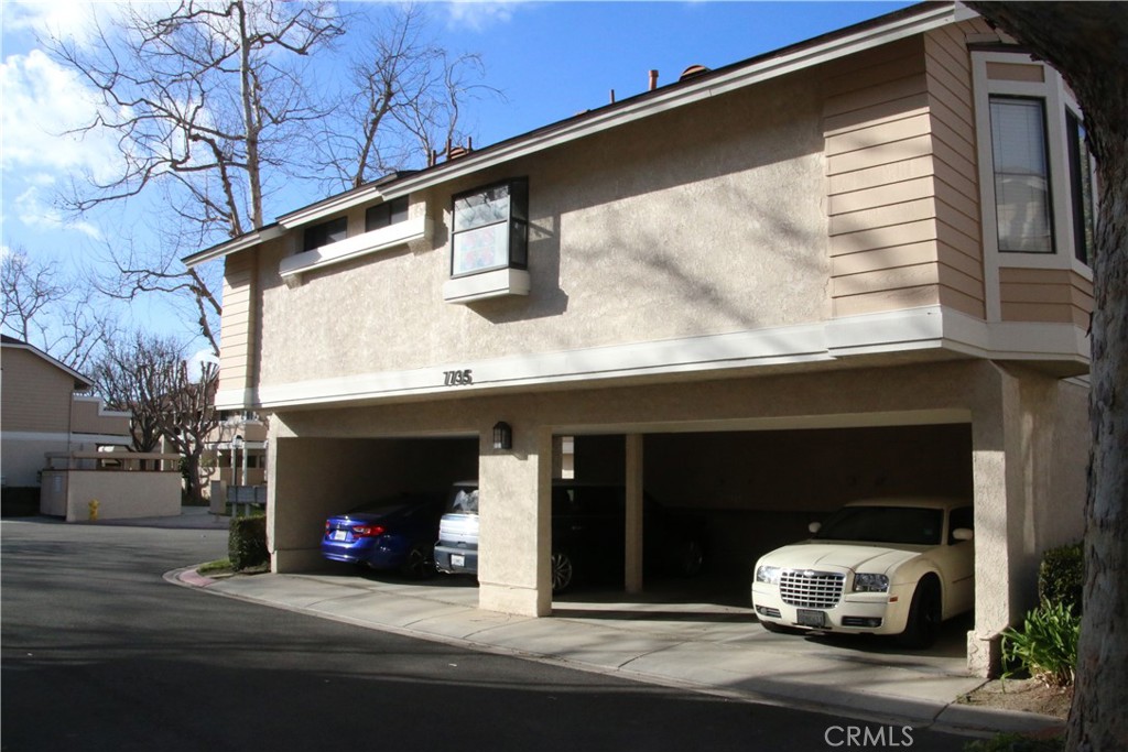 7735 Moordale Circle, Unit 246 Stanton, CA 90680 - Photo 20 of 21 a car parked in front of a house