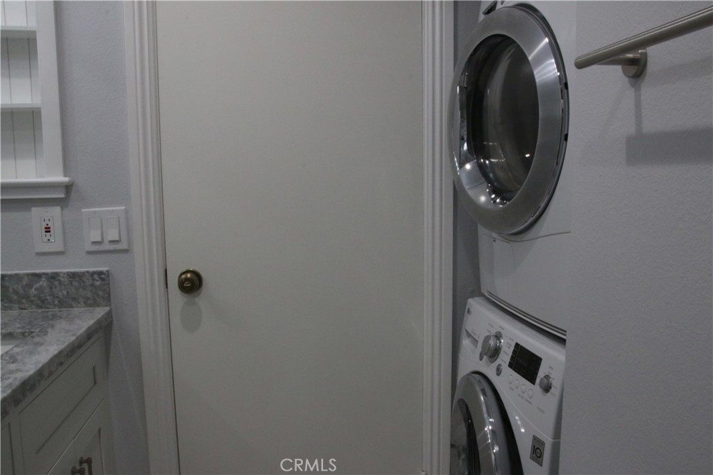 7735 Moordale Circle, Unit 246 Stanton, CA 90680 - Photo 6 of 21 a bathroom with a granite countertop sink and a mirror
