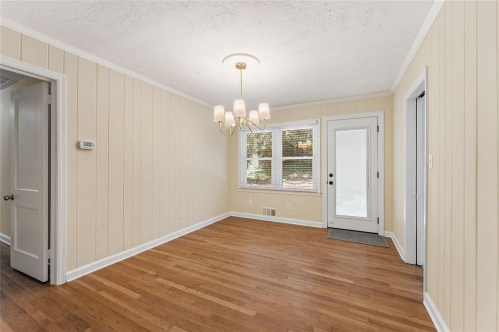 729 Timberland Street Smyrna, GA 30080 - Photo 12 of 26 a view of an empty room with wooden floor and a window