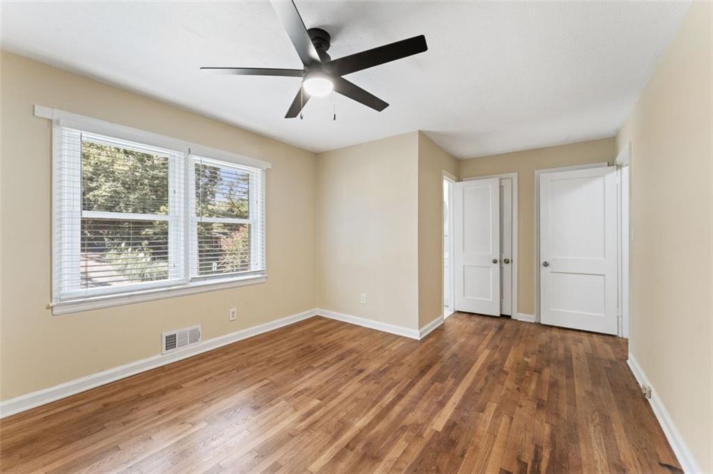 729 Timberland Street Smyrna, GA 30080 - Photo 16 of 26 a view of an empty room with wooden floor and a window