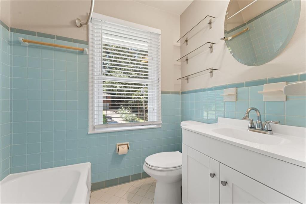 729 Timberland Street Smyrna, GA 30080 - Photo 17 of 26 a bathroom with a sink a toilet and mirror