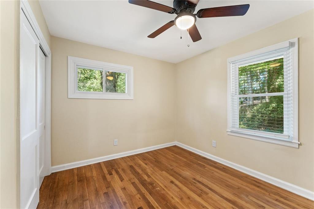 729 Timberland Street Smyrna, GA 30080 - Photo 19 of 26 an empty room with a window and a ceiling fan