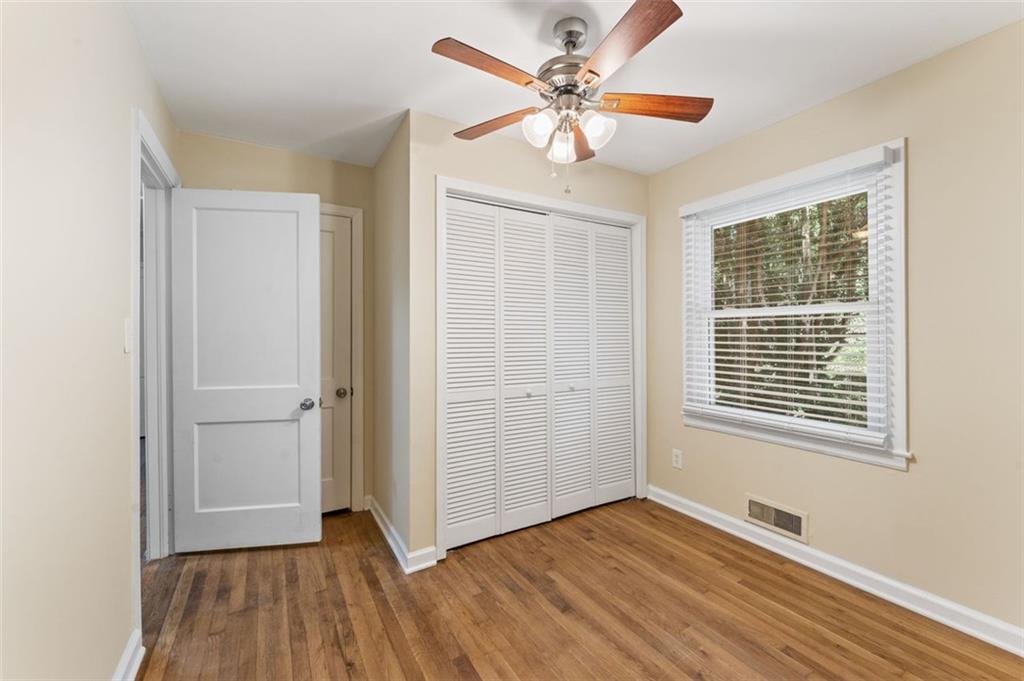 729 Timberland Street Smyrna, GA 30080 - Photo 20 of 26 a view of an empty room with wooden floor and a window