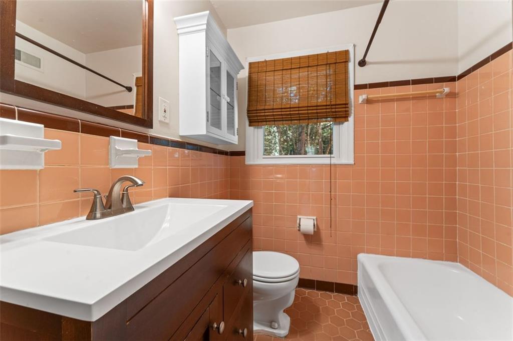 729 Timberland Street Smyrna, GA 30080 - Photo 21 of 26 a bathroom with a sink a toilet and shower