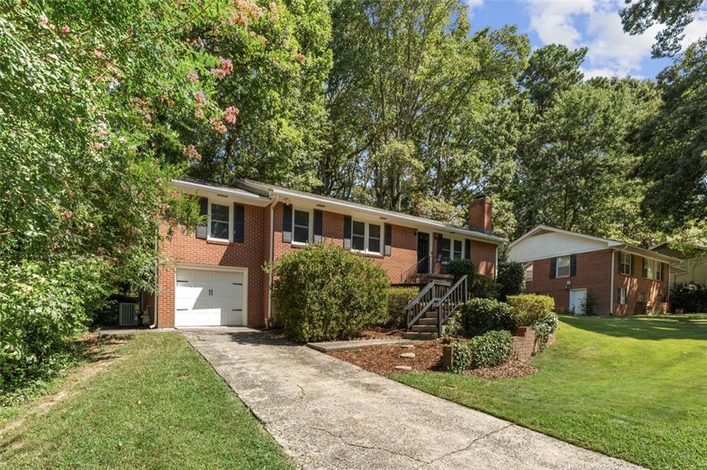 729 Timberland Street Smyrna, GA 30080 - Photo 3 of 26 a front view of house with yard and green space