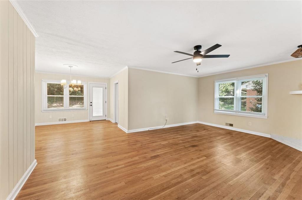 729 Timberland Street Smyrna, GA 30080 - Photo 8 of 26 a view of an empty room with a window and wooden floor