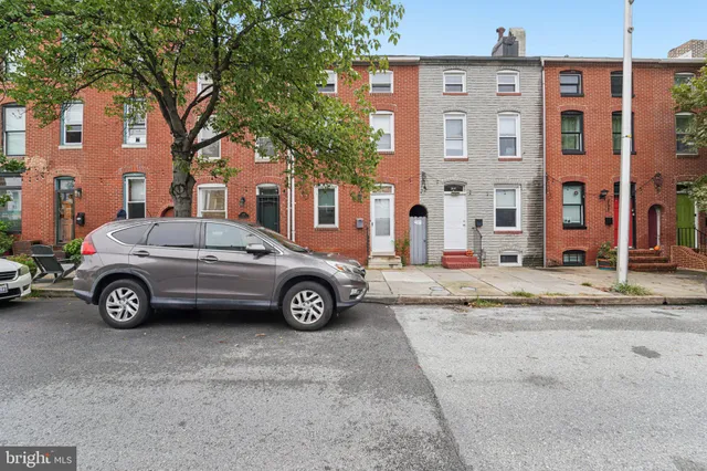 a car parked in front of a building