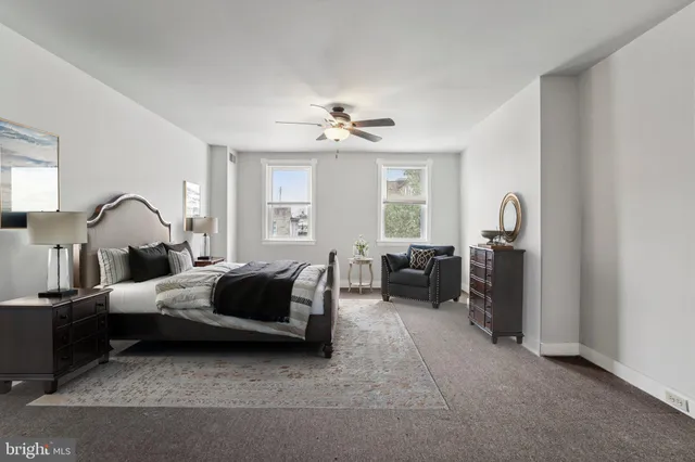 a bedroom with furniture and a window