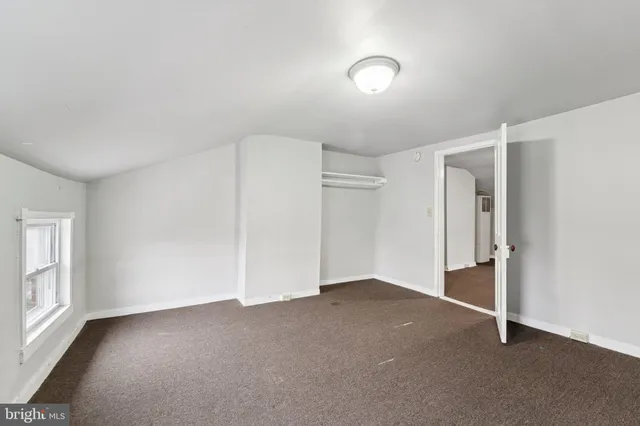 a view of a balcony with furniture