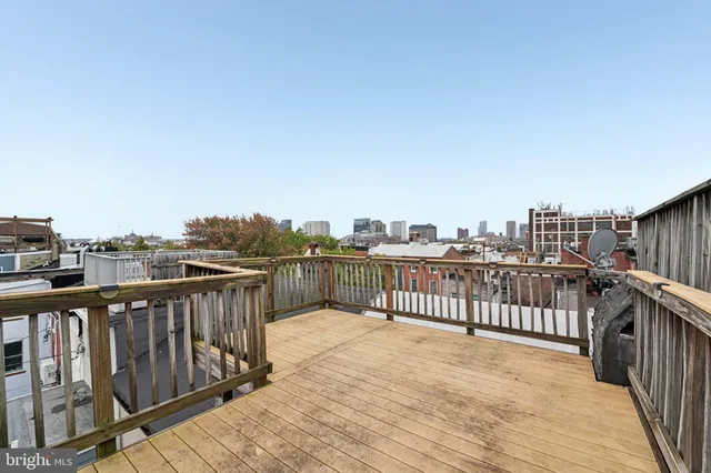 a view of a balcony with wooden floor