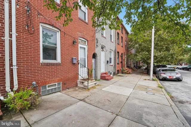 a view of a brick buildings with many windows