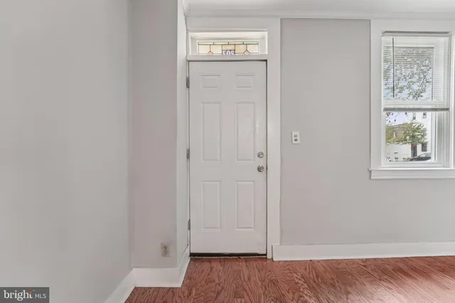 a view of an entryway with wooden floor