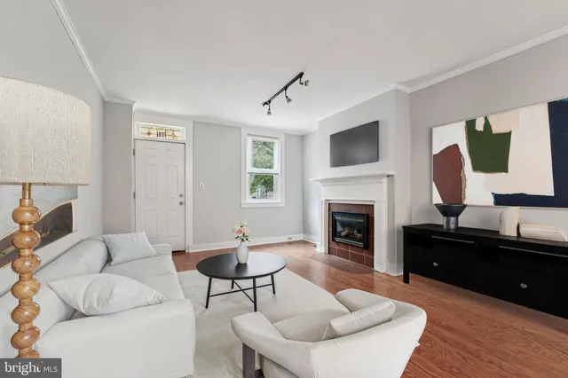 a living room with furniture fireplace and a flat screen tv