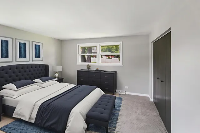 a bedroom with a bed and a cabinets