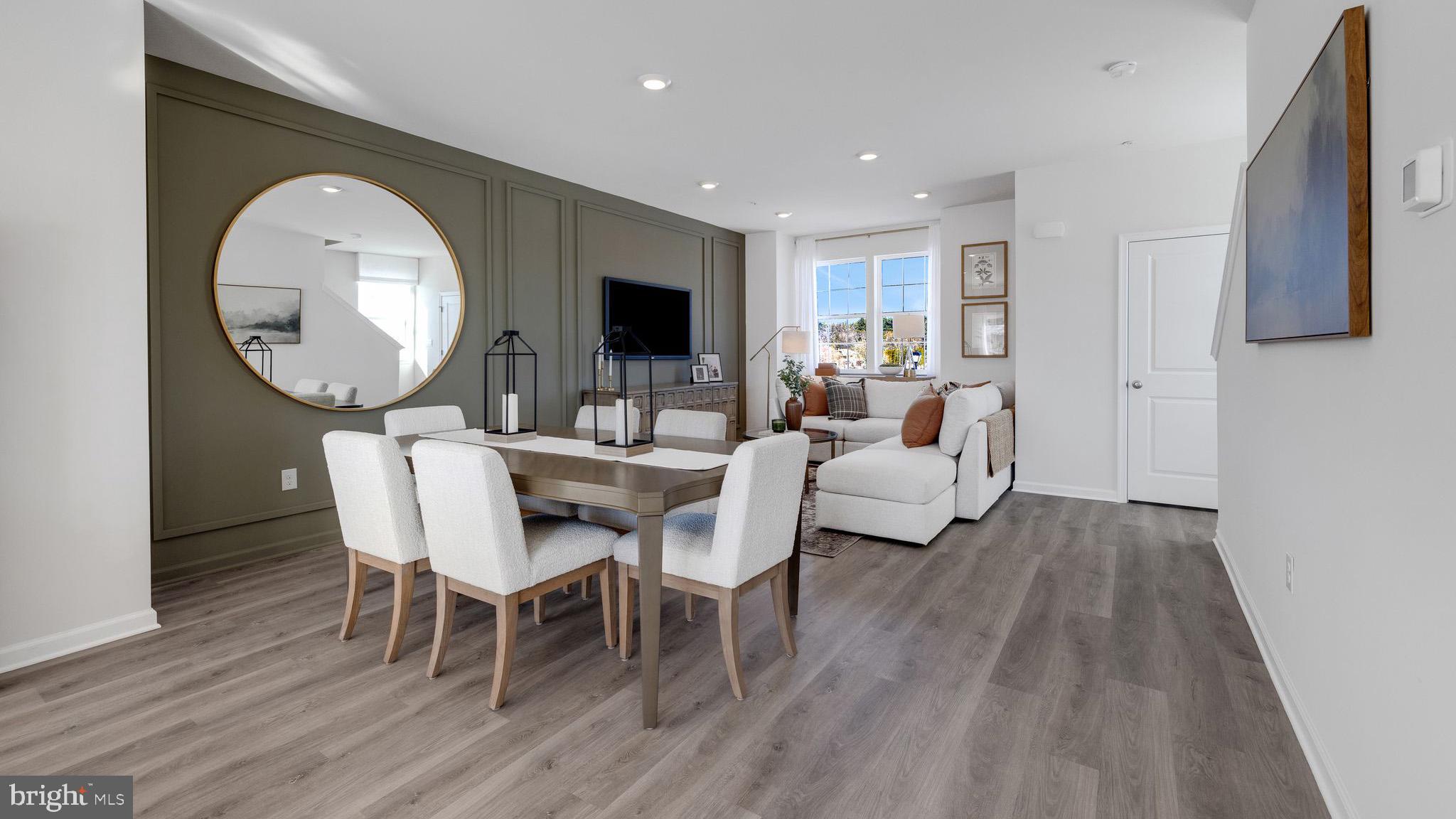 8305 Alexander Court Breinigsville, PA 18031 - Photo 12 of 25 a view of a dining room with furniture and wooden floor