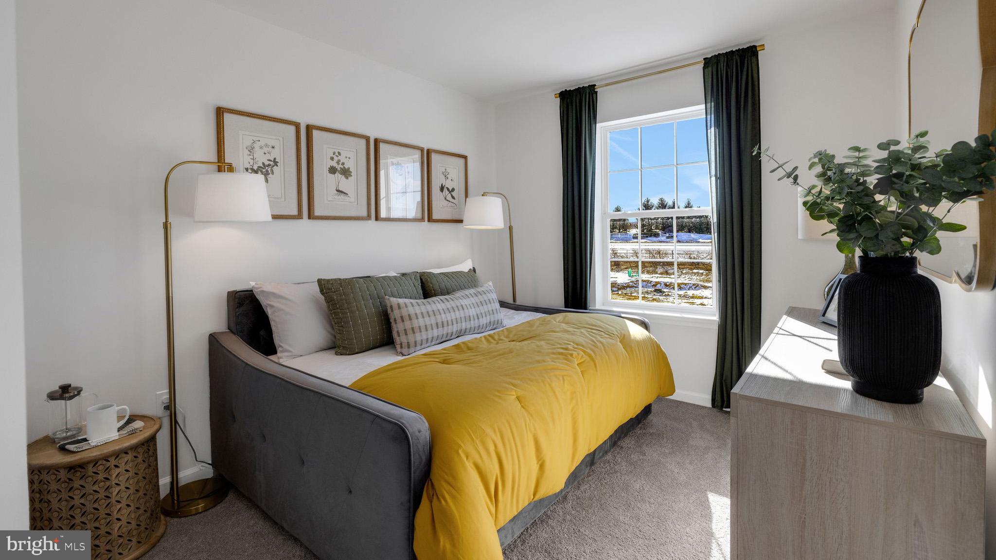 8305 Alexander Court Breinigsville, PA 18031 - Photo 22 of 25 a bedroom with a bed and a potted plant