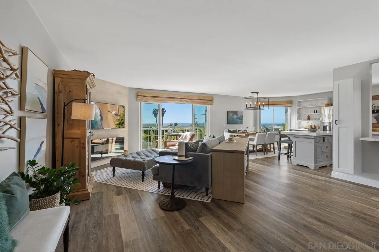 5366 La Jolla Boulevard, Unit 101C La Jolla, CA 92037 - Photo 22 of 41 a living room with fireplace furniture and a wooden floor