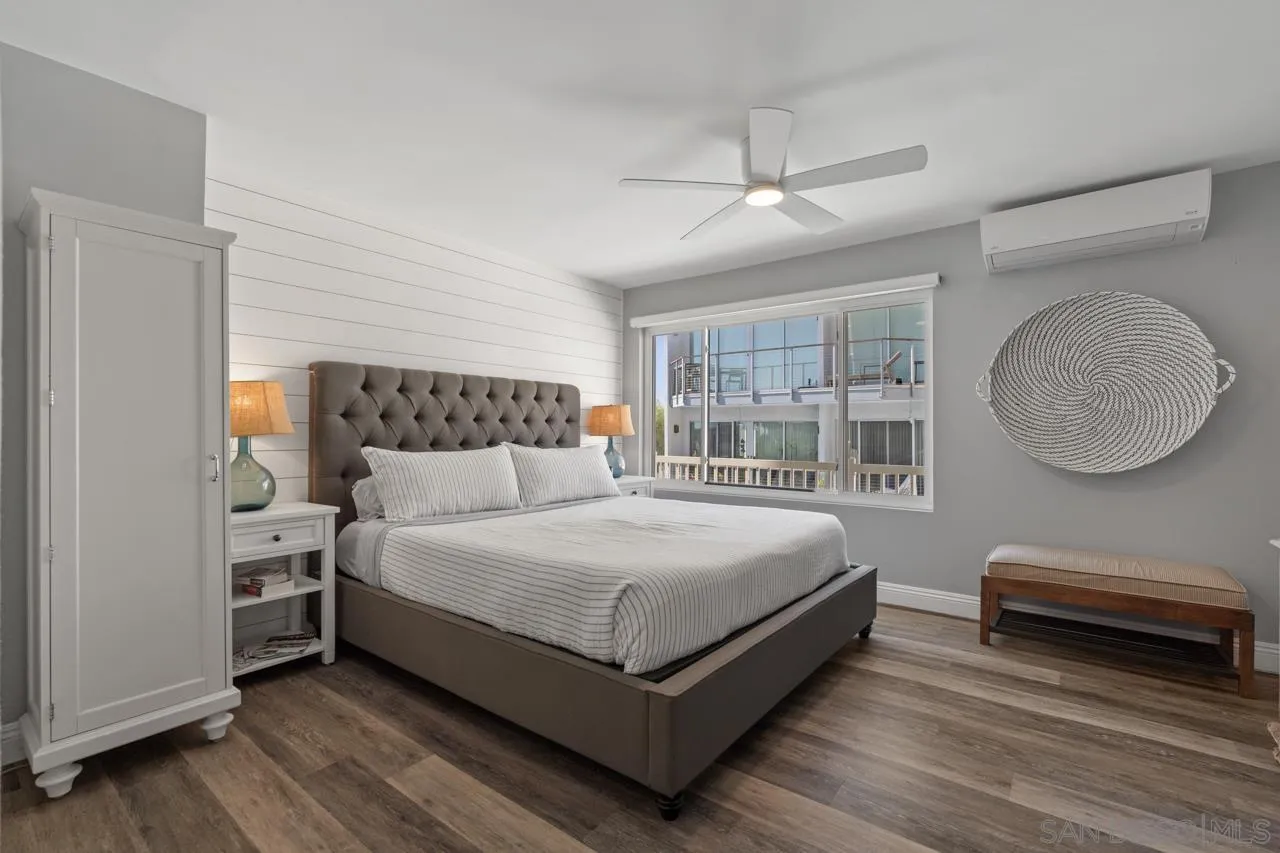 5366 La Jolla Boulevard, Unit 101C La Jolla, CA 92037 - Photo 29 of 41 a bed room with a bed and a mirror