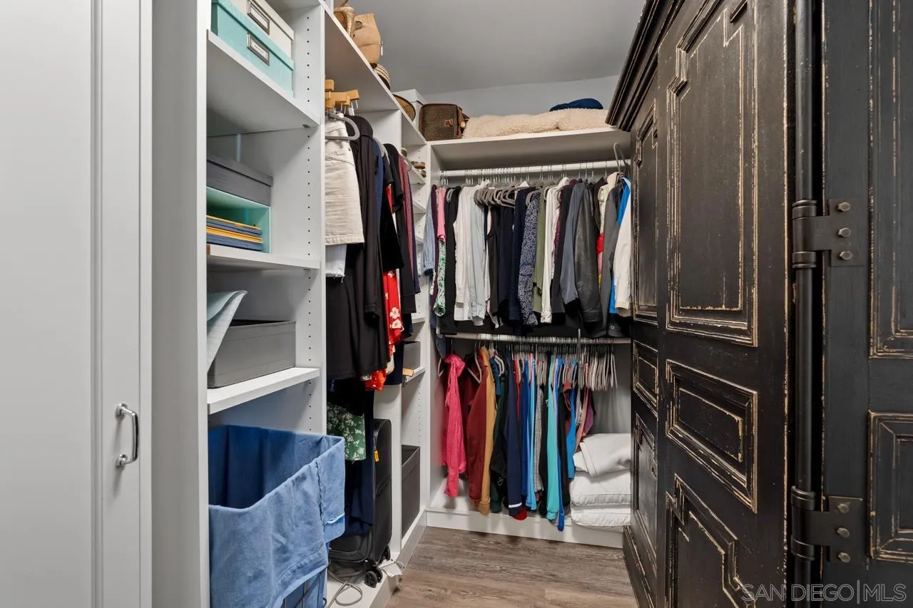 5366 La Jolla Boulevard, Unit 101C La Jolla, CA 92037 - Photo 35 of 41 a view of walk in closet with clothes and shoes