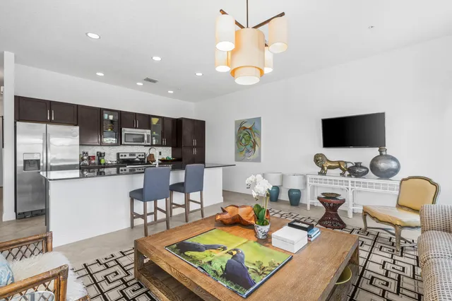 a living room with fireplace furniture and a flat screen tv