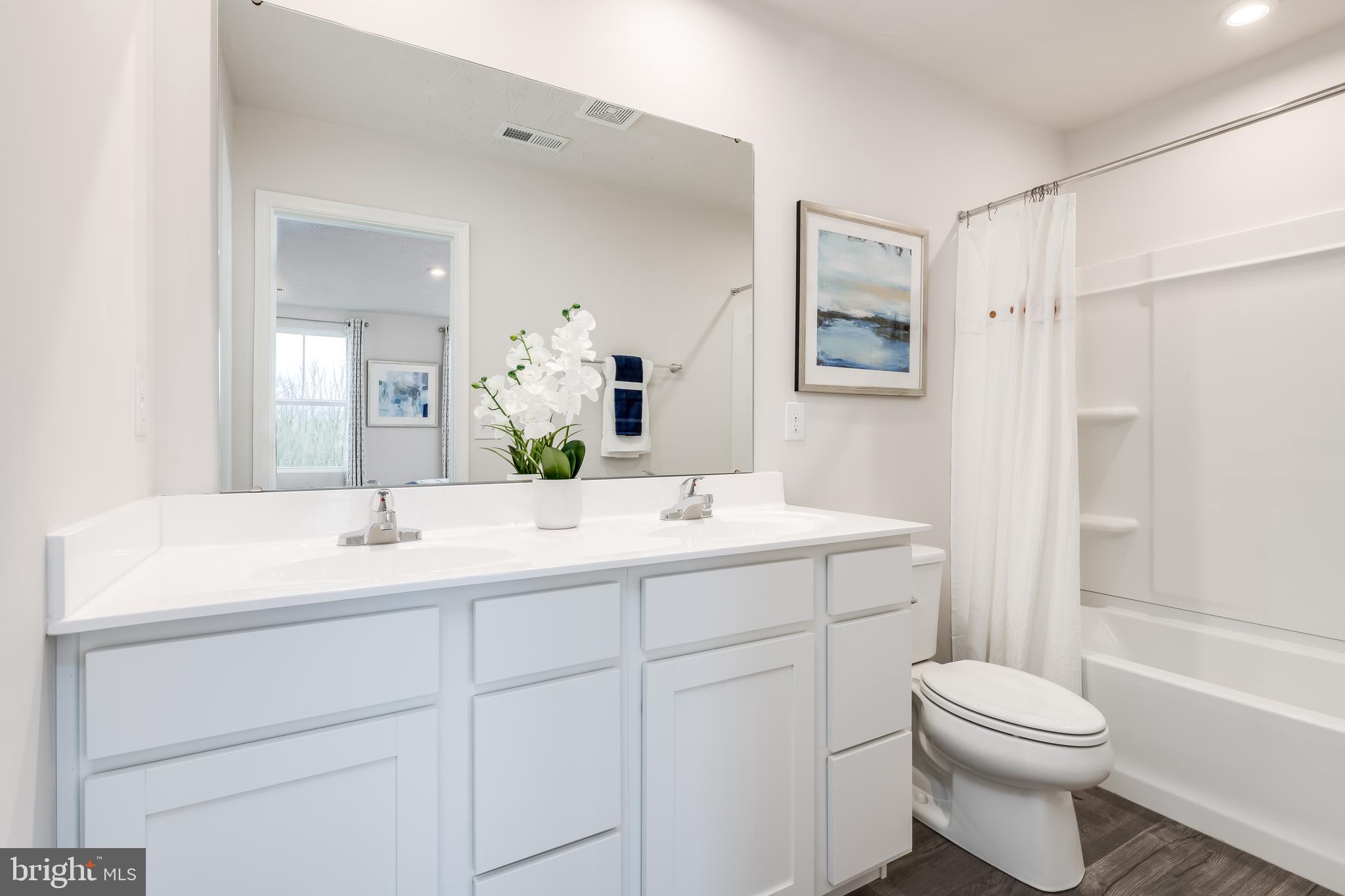 2204 Mutual Drive Inwood, WV 25428 - Photo 11 of 20 a bathroom with a sink toilet and shower