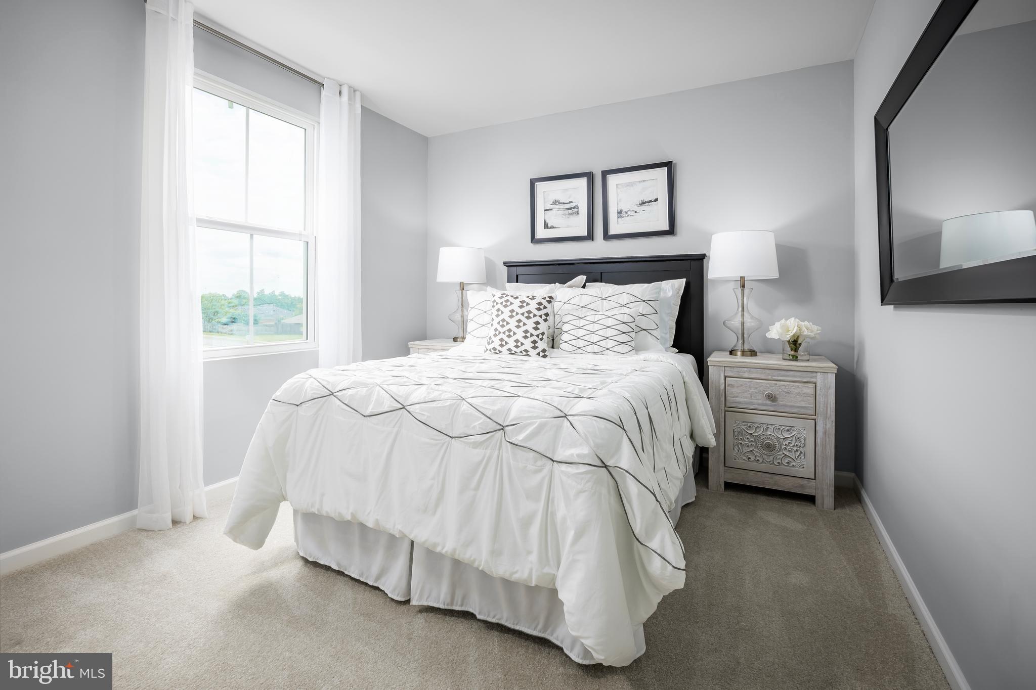 2204 Mutual Drive Inwood, WV 25428 - Photo 17 of 20 a bedroom with a bed and a tv