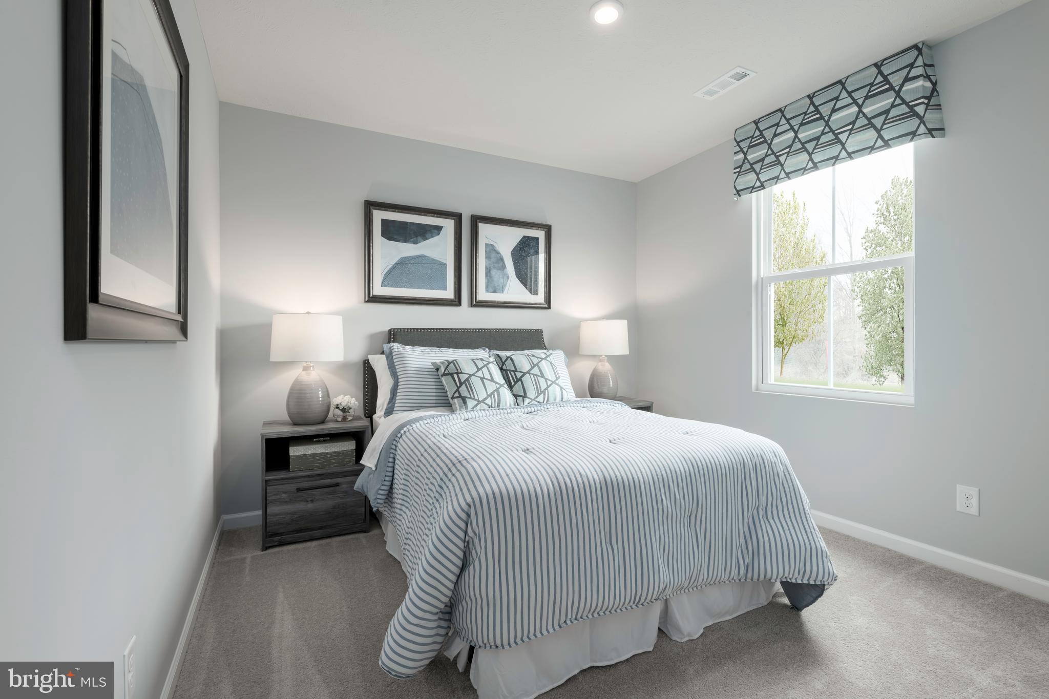 2204 Mutual Drive Inwood, WV 25428 - Photo 18 of 20 a bedroom with a bed and a window