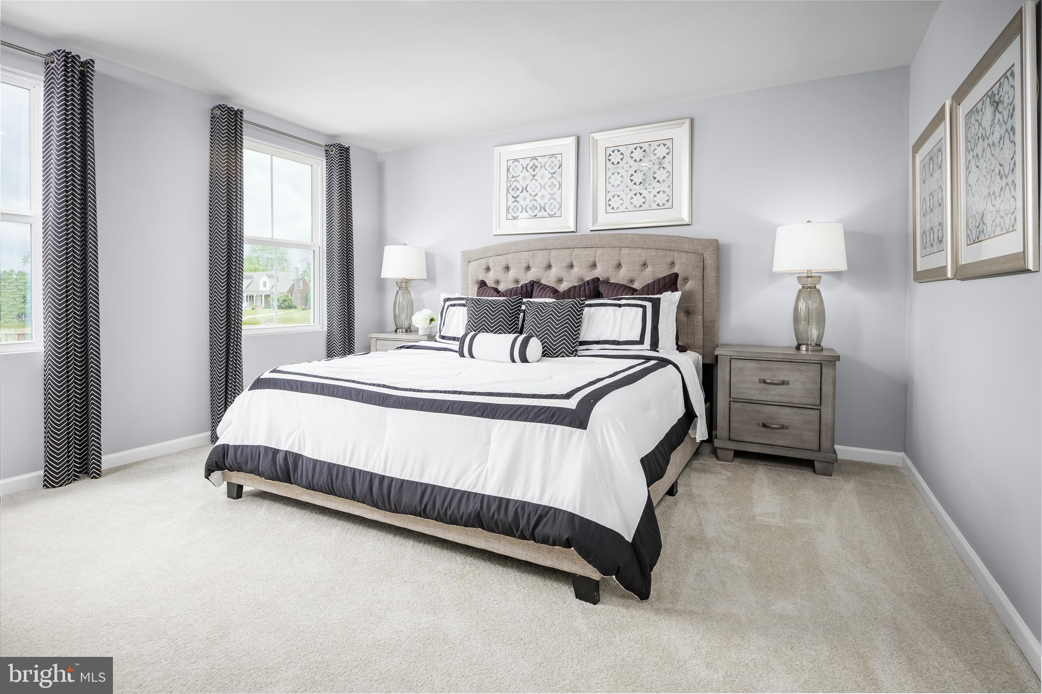 2204 Mutual Drive Inwood, WV 25428 - Photo 9 of 20 a spacious bedroom with a bed and a window