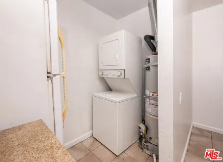a view of hallway with washer and dryer