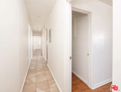 a view of a hallway with a white door