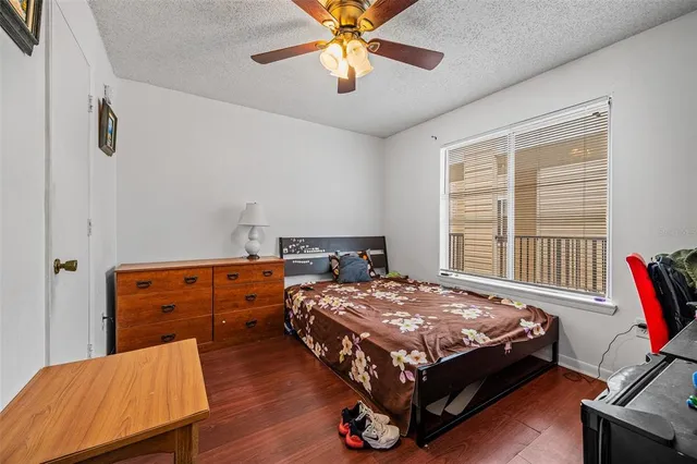 a bathroom with a toilet sink vanity and mirror