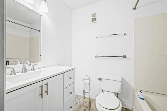 a bedroom with a bed and a chair