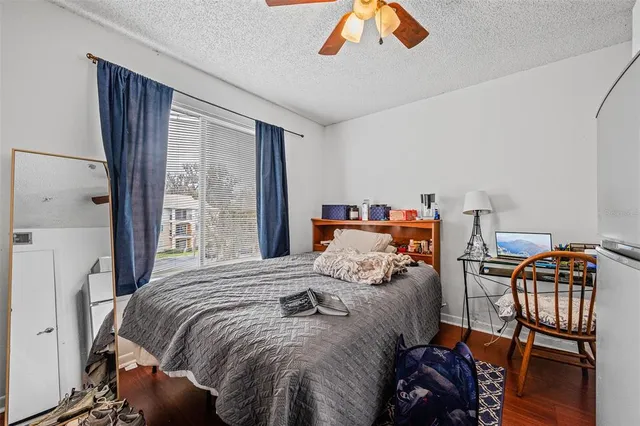a bathroom with a granite countertop toilet sink and a mirror