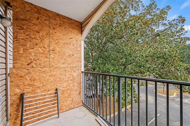 a view of a balcony with an outdoor space