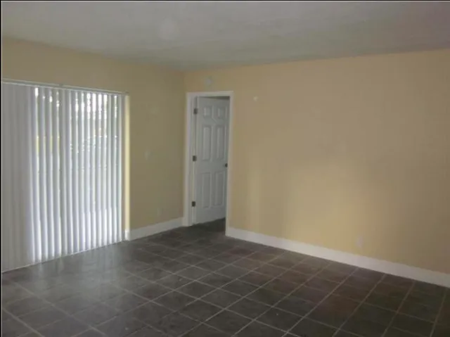 en empty room with windows