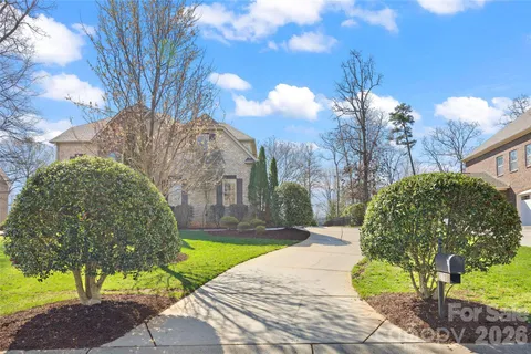 a view of a yard in front of a house