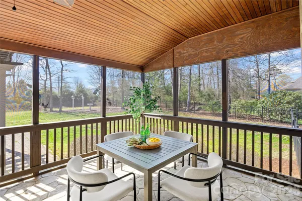 a view of a patio with wooden floor