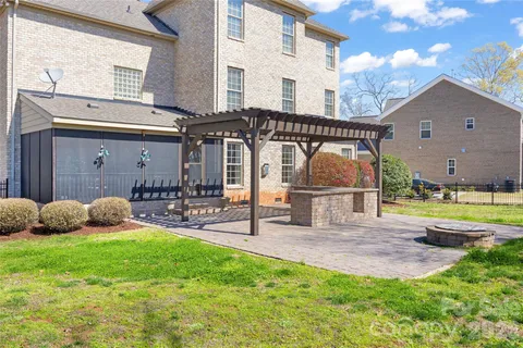 a front view of a house with garden and patio
